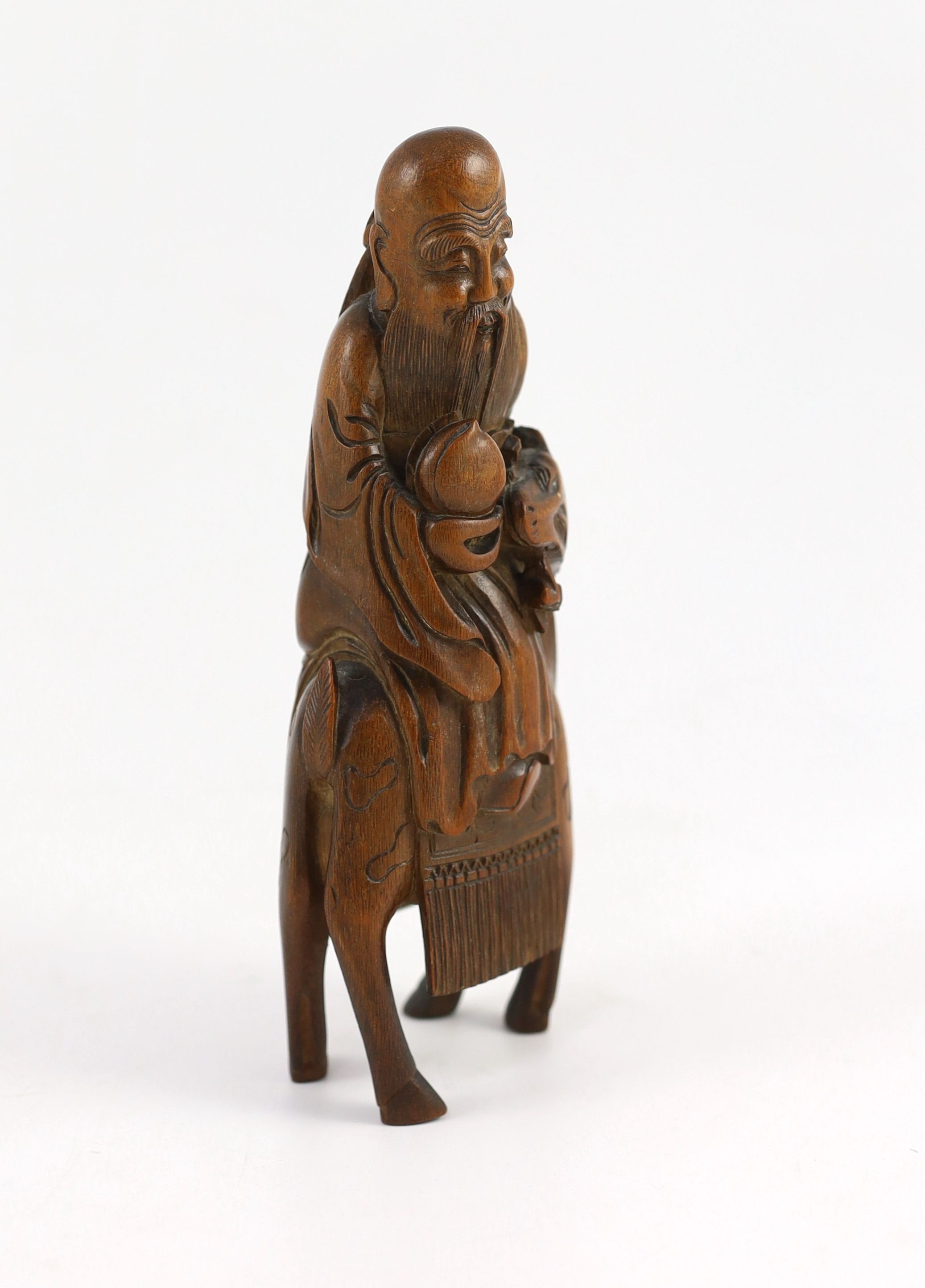 A Chinese bamboo group of Shou Lao riding a deer, 18th/19th century, 21cm high